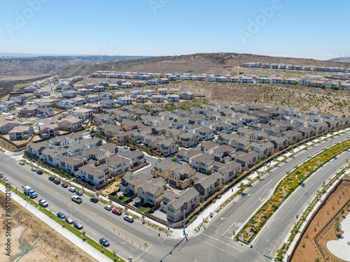 New development real estate. Aerial view of residential houses and driveways neighborhood in south San Diego, Chula Vista. Packed homes. Top view over private houses