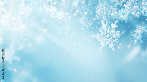 青い雪の結晶が広がる冬のきらめく背景素材
