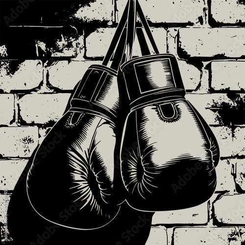 Pair of boxing gloves hanging on a brick wall silhouette