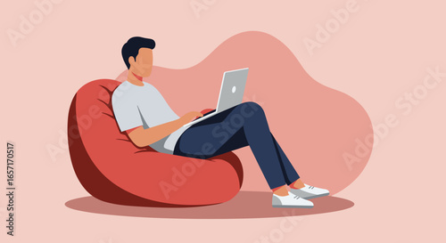 Man comfortably works or studies from home on a laptop while relaxing on a bean bag chair. Ideal for remote work, online learning, and casual lifestyle concepts.