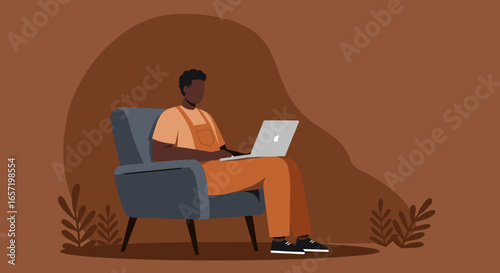 African American man uses a laptop comfortably in an armchair, ideal for themes of remote work, home office, and digital lifestyle.