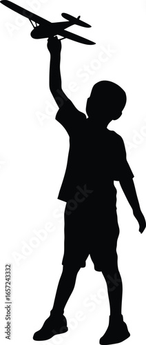 Silhouette of Boy Holding Toy Airplane in the Air