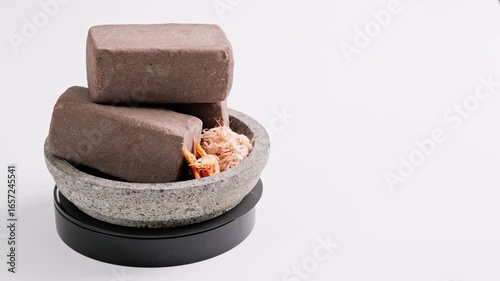 Traditional Indonesian Shrimp Paste Terasi on mortar stone