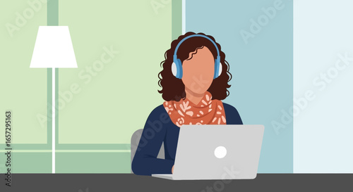 Woman with headphones works on laptop, representing remote work, online learning, or virtual communication in a modern home office setting.