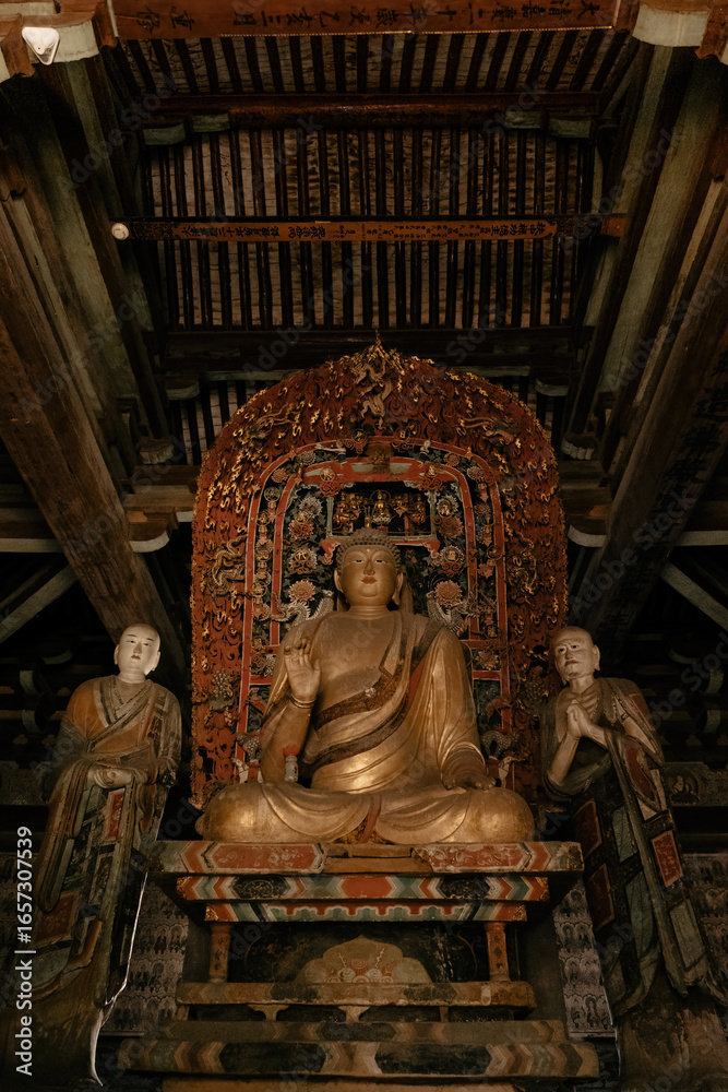 Fototapeta premium Historical Chinese temple featuring intricate sculptures and a prominent Buddha idol