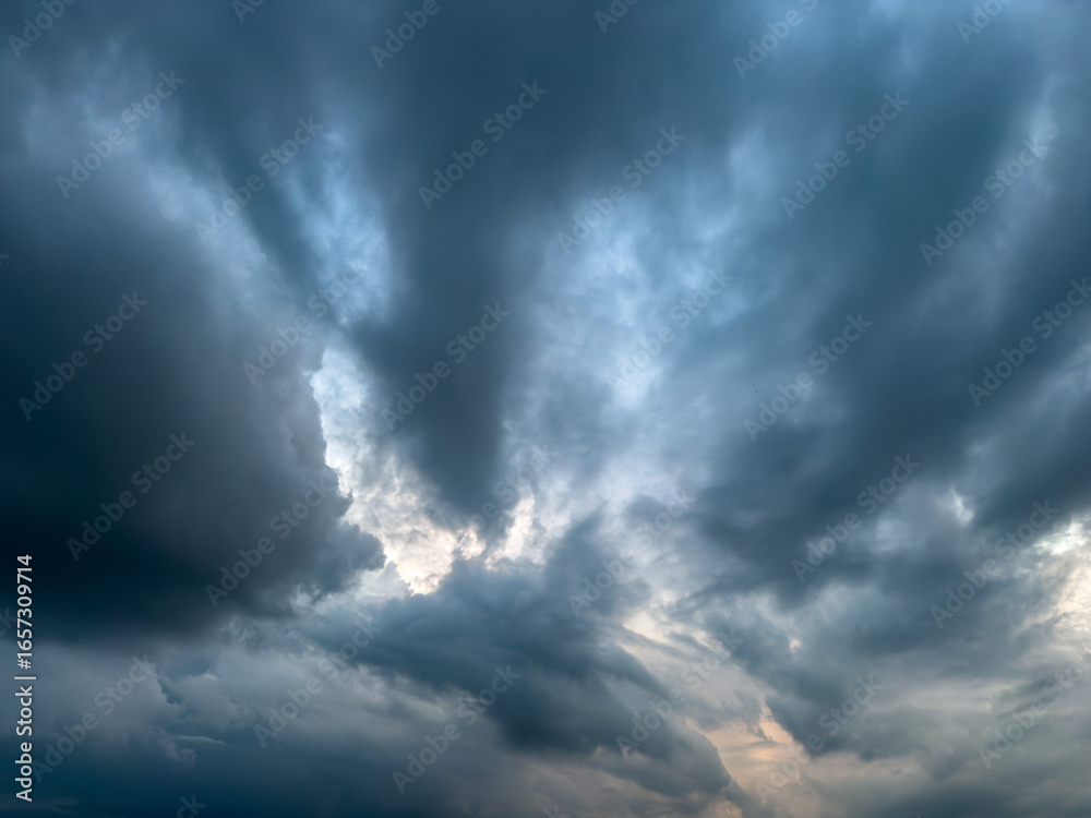 Obraz premium Stormy rainy grey blue clouds .