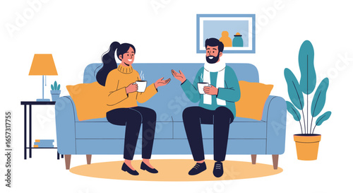 Friends enjoying hot drinks and conversation on a cozy sofa