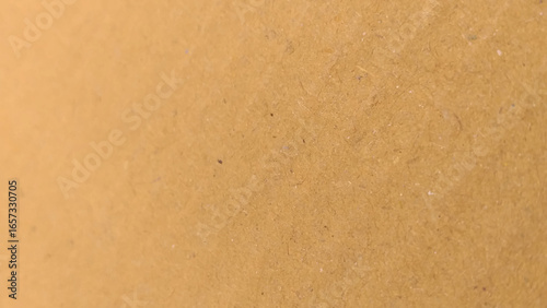Background of brown kraft paper or cardboard texture. old paper sheet, parchment or papyrus surface.