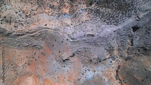 Rotating birdseye view of the rugged terrain in the Gorafe desert, Spain