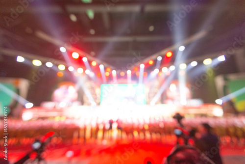 blurred background of event concert or award ceremony with lighting at conference hall