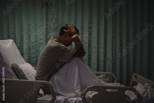 Man with heavy headache in hospital