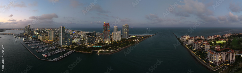 Obraz premium Aerial panoramic view of Miami skyline. Panoramic cityscape of Miami with coastal skyscrapers. Panoramic view of Miami Beach from above. Iconic landmarks line of Miami coastline. Miamis famous skyline