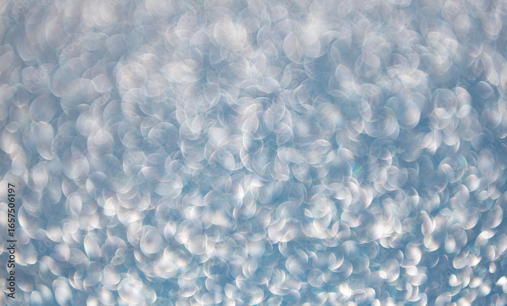 Fototapeta premium Glitter shimmer background. Defocused shimmer. Bokeh backdrop shimmer. Bokeh effect. Glitter shine. Bokeh shimmering background. Blurred defocused background. Blur glitter backdrop. Glitter sparkles
