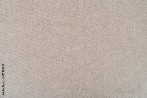 Pale brown fleece fabric texture. Pale brown fabric background of soft and smooth textile material. Fabric texture for design and decoration. Top view. 