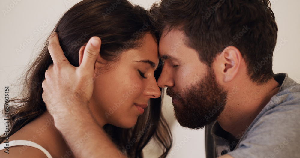 Fototapeta premium Forehead, love and romance with connection of couple in home bedroom together for bonding or safety. Moment, security or trust with man and woman in apartment for anniversary, honeymoon or wellness