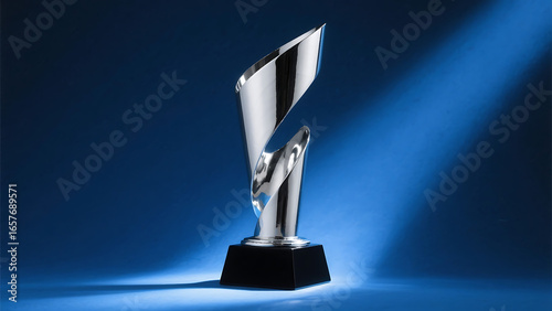 Modern silver award trophy with a spiral design on a blue background, elegant prize for achievement and success, competition or victory concept