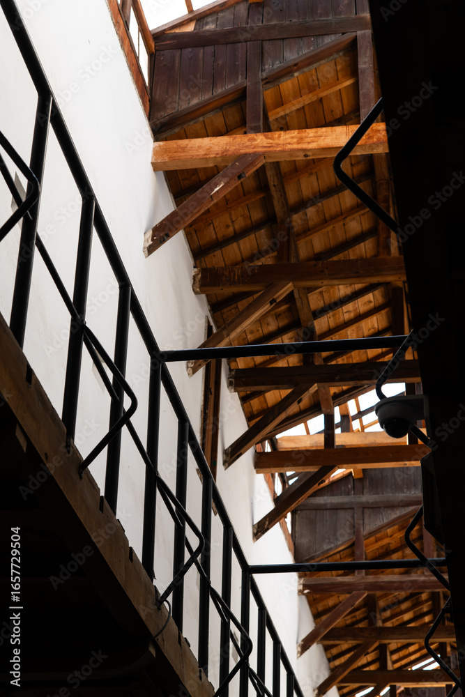 Obraz premium low angle view of the wooden structure at the museum building
