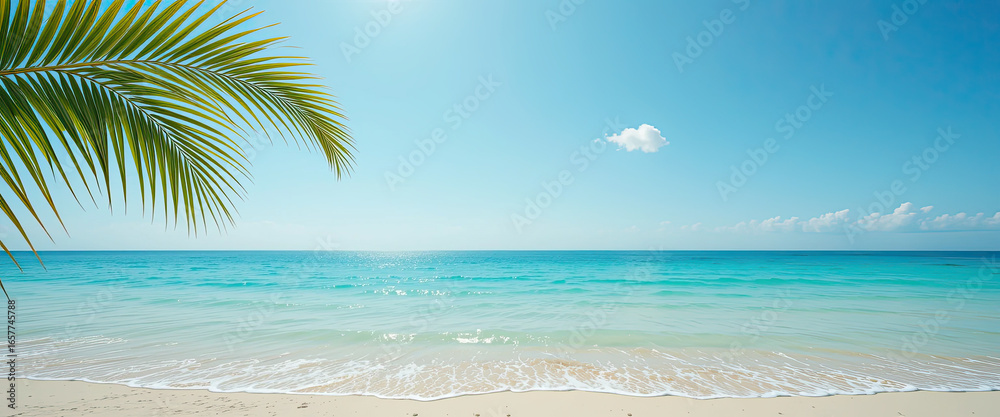Fototapeta premium Tropical beach with turquoise sea, clear blue sky and coconut palm leaves in foreground, idyllic summer seascape background symbolizing relaxation, paradise vacation and natural coastal beauty 