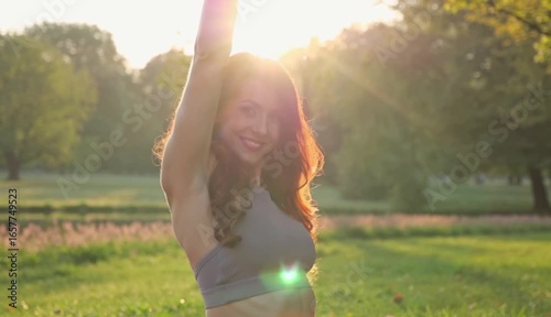 Smiling Woman Outdoors in a Sunny Park During a Beautiful Morning