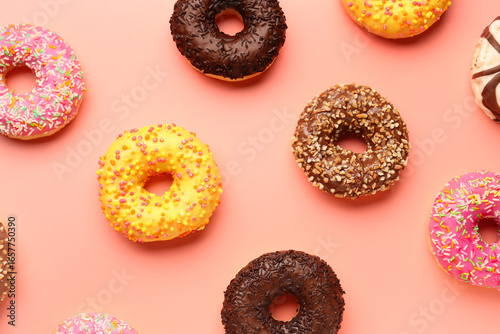 Sweet donuts on pink backgr...