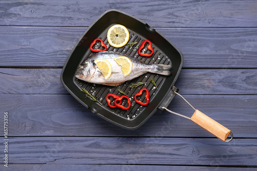 Grill pan of raw dorado fis...