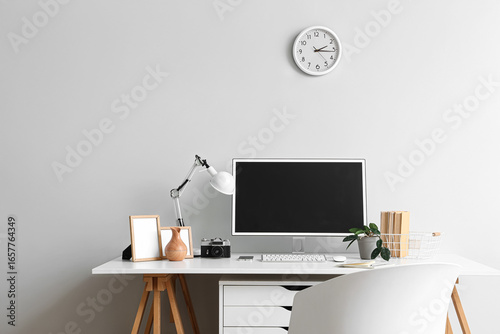 Stylish workplace with mode...