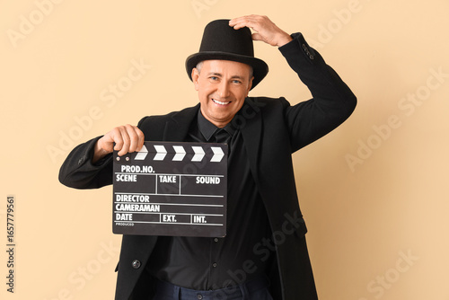 Mature actor with clapperbo...