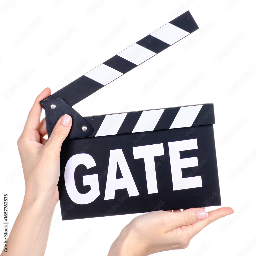Obraz premium A person holds a black and white film clapperboard with the word 