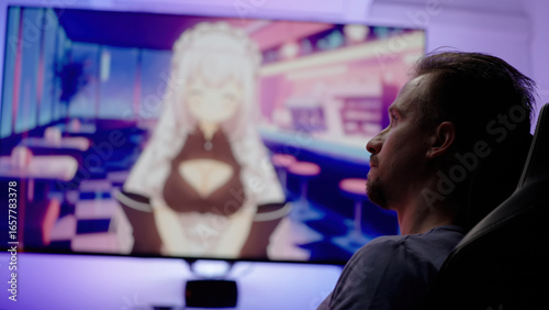 Watching Japanese anime with cute maids on big screen television at home cinema
