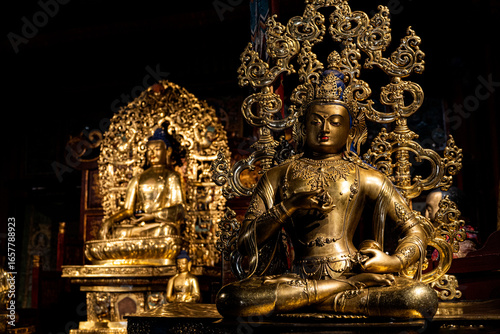 Canvas Print Golden bodhisattva statue with ornaments