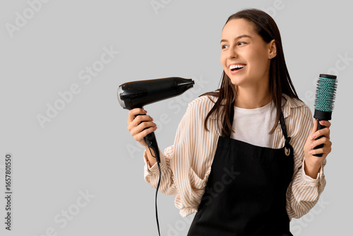 Female hairdresser with dry...