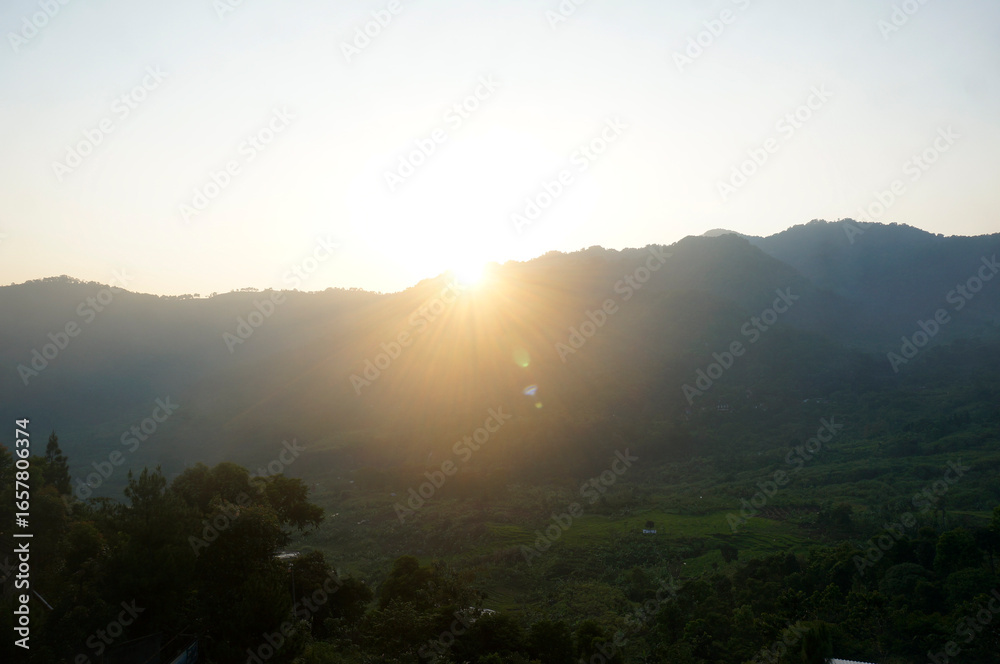 Obraz premium Sunrise Over The Hillside. Panoramic View Of The Mountains.