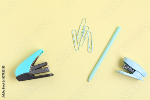 Blue staplers with clips an...