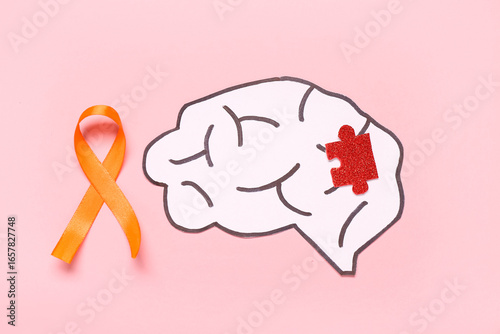 Paper brain with orange rib...