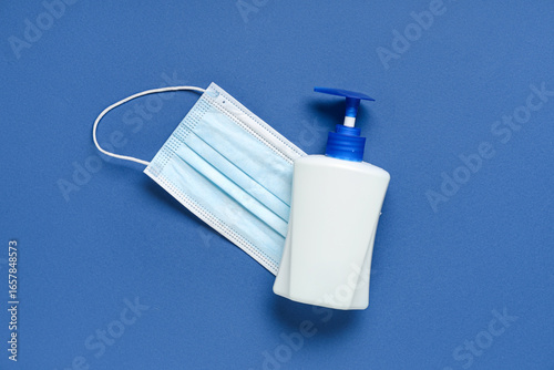 Bottle of sanitizer and mas...