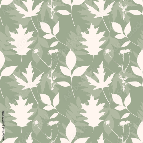 Green textile pattern. Autumn Vibe. Soft pattern with beige leaves silhouettes. Herbarium.
