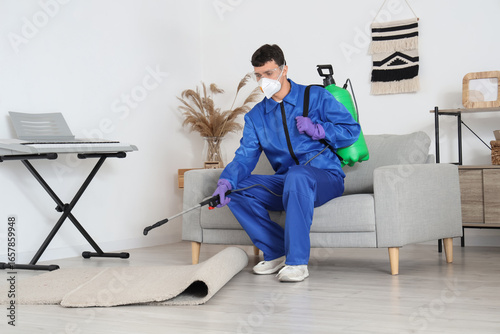 Male worker disinfecting ca...