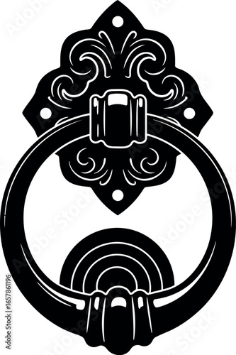 Ornate black metal door knocker with decorative backplate and ring for vintage entrance