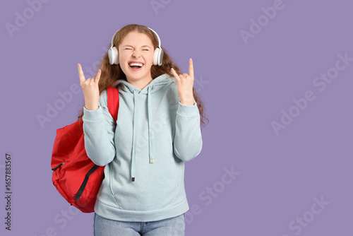 Happy female student with b...