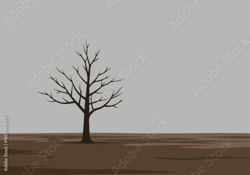 Solitary tree silhouette on barren land with cloudy sky, can be used to show loneliness