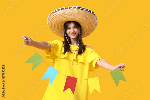 Young woman in sombrero hol...