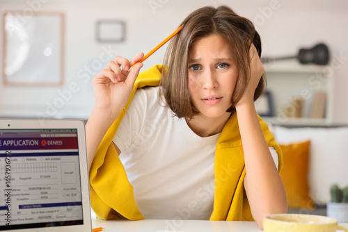 Upset teenage girl with den...