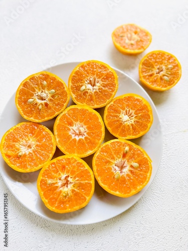 Slices of Tangerines on Plate