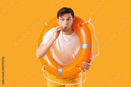 Male lifeguard with rescue ...