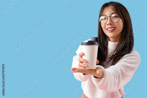 Young Asian woman with cup ...