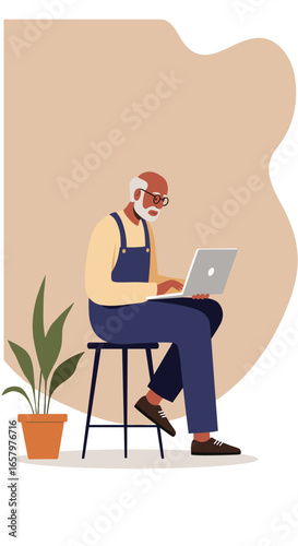 An engaged senior man with glasses and beard sits on a stool, diligently using a laptop, embodying modern digital literacy and active retirement.