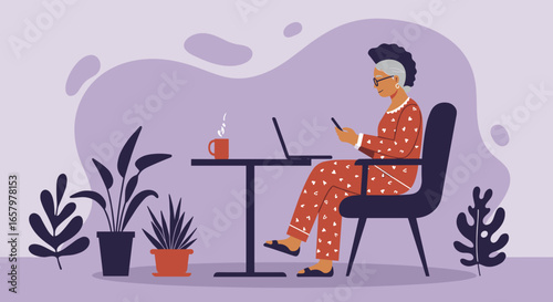 Senior woman in pajamas working from home on laptop and smartphone. Represents remote work, modern lifestyle, and digital communication for older adults.