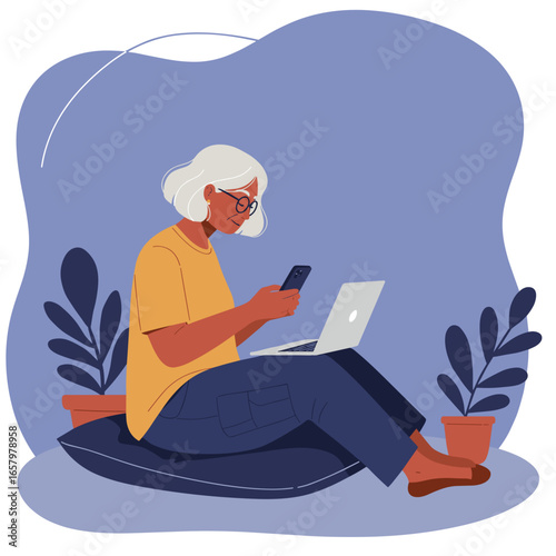 A senior woman engages with her smartphone and laptop at home. Depicts digital literacy, online learning, and modern remote work for the elderly.