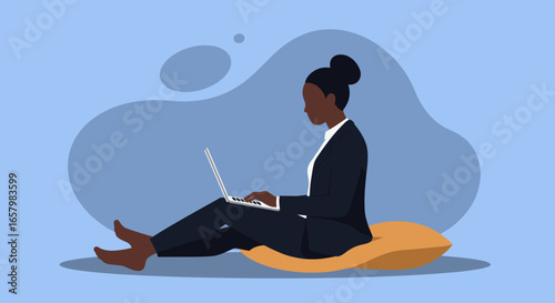 Professional Black woman working remotely on laptop from comfortable home setting. Represents productivity, flexible work, and modern business lifestyle.