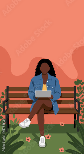 A young Black woman sits on a park bench, focused on her laptop. Ideal for themes of remote work, online learning, urban lifestyle, and digital nomad concepts.